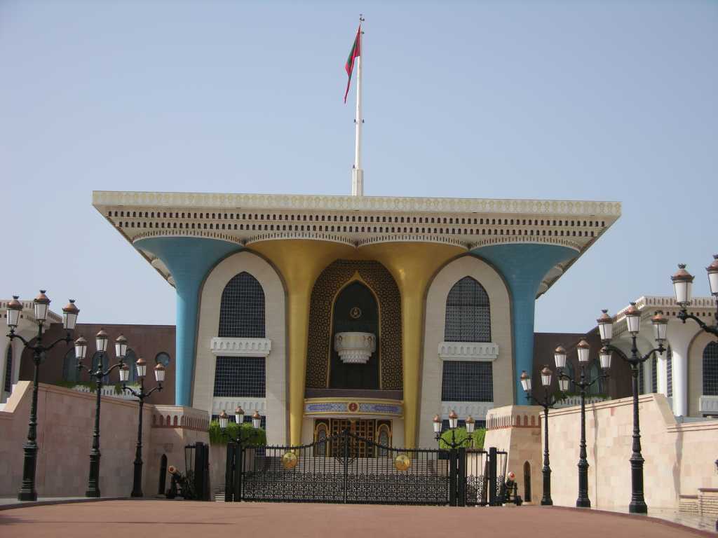 Muscat 02 Muscat 05 Sultan Qaboos Al-Alam Palace Heres the entrance to the ceremonial Sultan Qaboos Al-Alam Palace in Muscat. Built in 1972, the Al Alam Palace has a fairytale faade of towering gold and blue pillars wrapped in wrought iron and edged in green - is it my imagination or does it look like a plastic pack of golf tees? Sultan Qaboos has ruled Oman since he deposed his father in a 1970 palace coup. After taking power, Sultan Qaboos liberalized politics in Oman and modernized the countrys economy, expanding health care, education, trade, infrastructure, and communications. Qaboos also developed Omans oil industry, which has brought prosperity to what was formerly one of Arabias poorest countries.